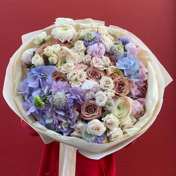 Bouquet of hydrangeas, roses, spray roses, ranunculus, peonies and ...