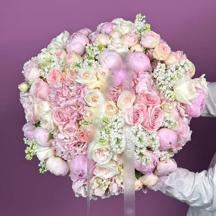 Couture Bloom – graceful arrangement of roses in chic couture wrapping – fresh flowers by Flower Power