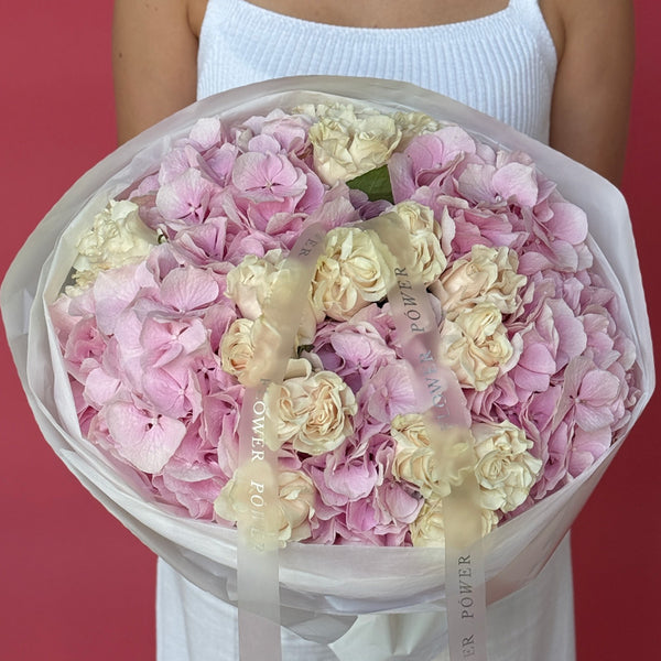 Bouquet of pink hydrangeas and cream spray roses Rose Quartz