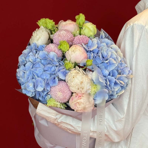 Bouquet of hydrangeas, peonies, eustoma and chrysanthemums Tender Blue
