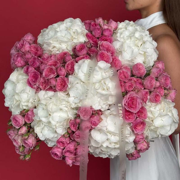 Bouquet of white hydrangeas and pink spray roses Amour Vivid