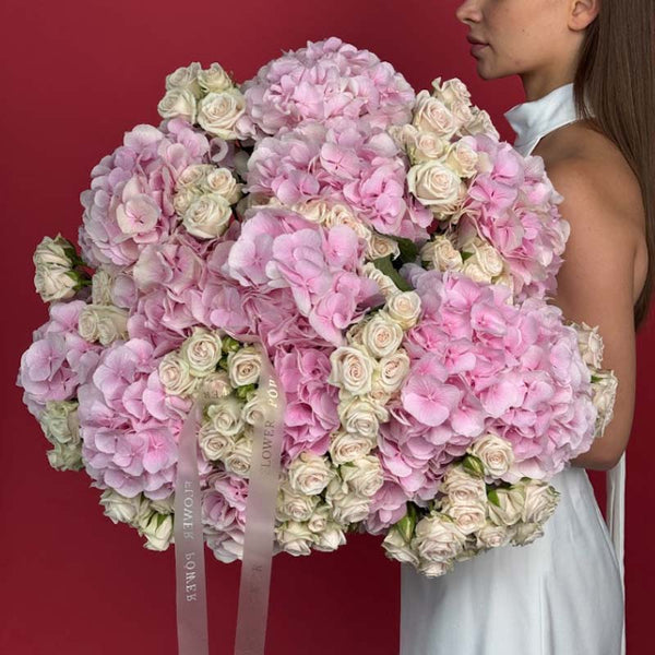 Bouquet of blush hydrangeas and ivory garden spray roses Rose Mirage